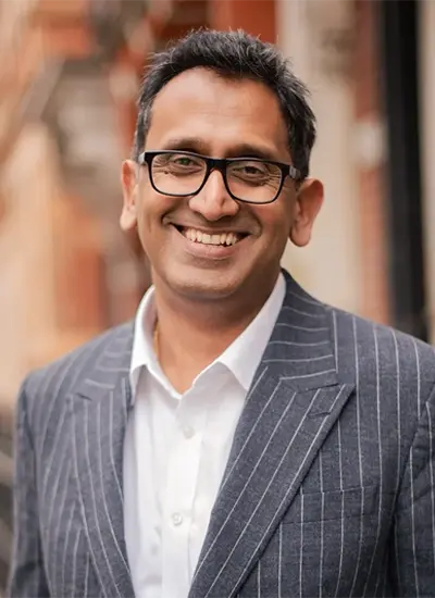 Professor Prasanna Sooriakumaran, Consultant Urologist, portrait in a pinstripe suit